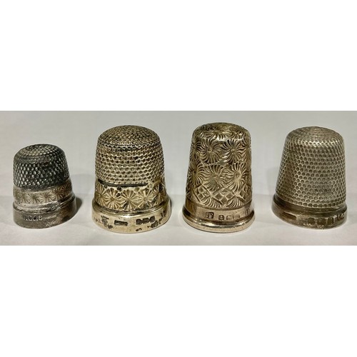 121 - Three hallmarked silver thimbles; another, marked Sterling (4)