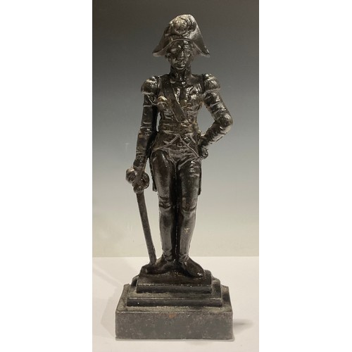 123 - A cast iron doorstop, Lord Nelson, in feathered hat with sword by his side, stepped base, 39cm