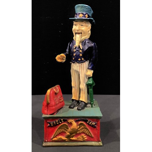 137 - American Interest - a reproduction cast iron novelty money box or bank, as Uncle Sam dispensing coin... 