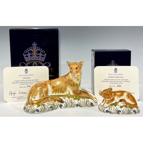 9 - A pair of Royal Crown Derby paperweights, Lioness and Sleepy Lion Cub, both are number 216 of a gold... 