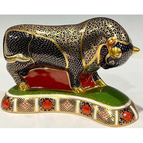 25 - A Royal Crown Derby paperweight, Grecian Bull, the base printed with an 1128 pattern border, gold st... 