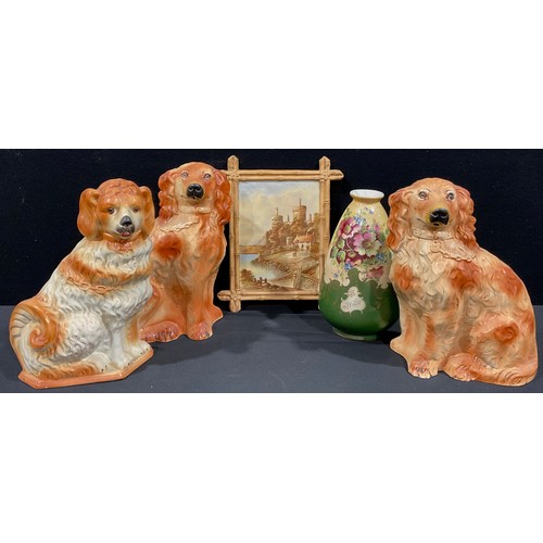 65 - A pair of Victorian Staffordshire mantel dogs, glass eyes, 32cm high; another mantel dog; a Stafford... 