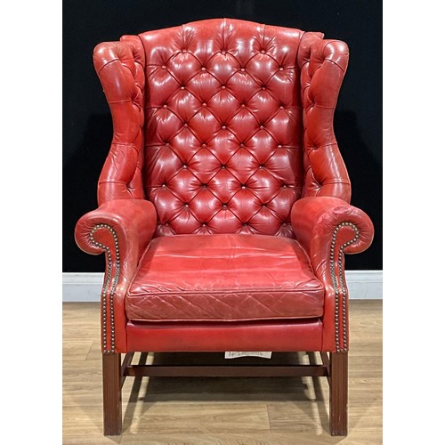 103 - A George III style wing chair, 115cm high, 81cm wide, the seat 50cm wide and 56cm deep