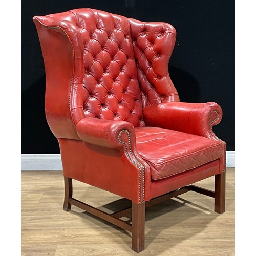 103 - A George III style wing chair, 115cm high, 81cm wide, the seat 50cm wide and 56cm deep