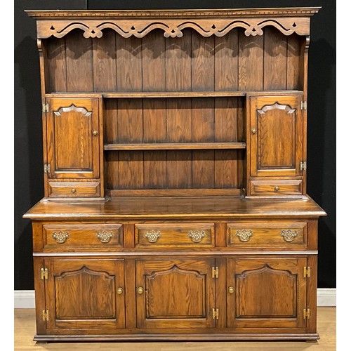 105 - A George III style oak dresser, 198cm high, 175.5cm wide, 51cm deep