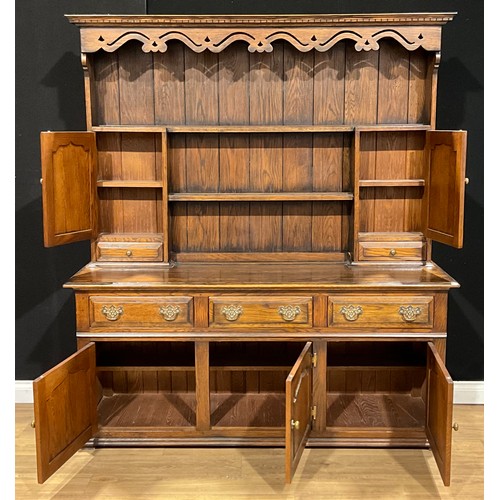 105 - A George III style oak dresser, 198cm high, 175.5cm wide, 51cm deep