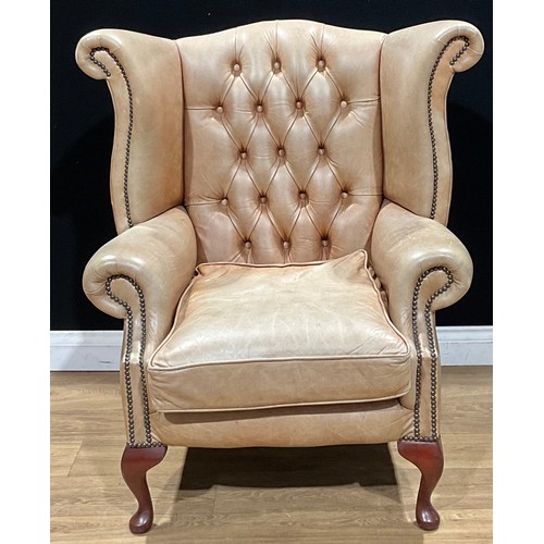 110 - A contemporary George III style Chesterfield type wing chair