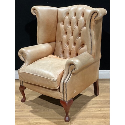 110 - A contemporary George III style Chesterfield type wing chair