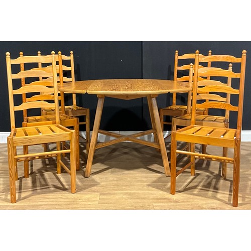 113 - An Ercol pine dropleaf dining table, 72cm high, 64.5cm opening to 124.5cm long, 113.5cm wide; a set ... 