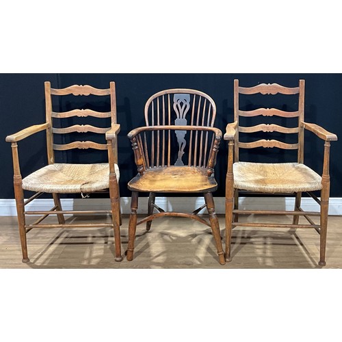 117 - A 19th century yew, beech, ash and elm Windsor elbow chair, 90cm high, 53.5cm wide; a pair of vernac... 