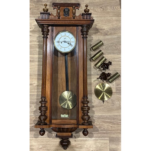 484 - A mahogany Vienna wall clock, white enamel dial, Roman numerals, subsidiary seconds dial, twin windi... 