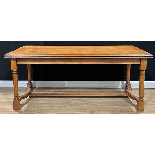 486 - An 18th century style oak servants’ hall or refectory dining table, draw-leaves to ends, turned legs... 