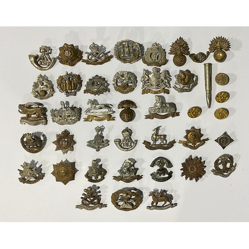 502 - A large collection of WW1/WW2 British military cap badges, however all have had the sliders and lugs... 