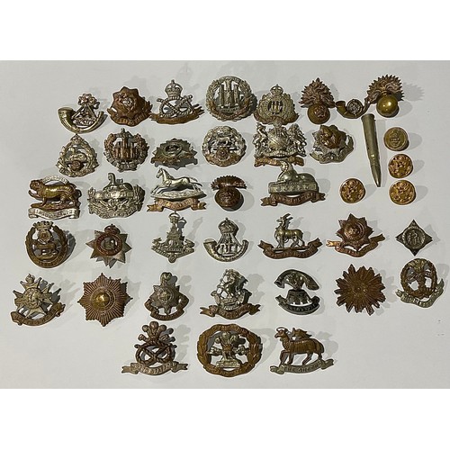 502 - A large collection of WW1/WW2 British military cap badges, however all have had the sliders and lugs... 