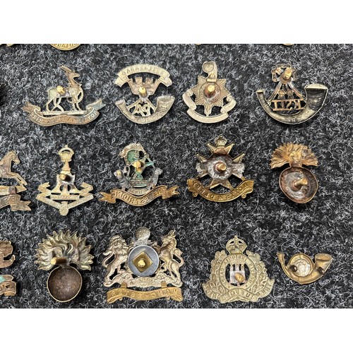 502 - A large collection of WW1/WW2 British military cap badges, however all have had the sliders and lugs... 