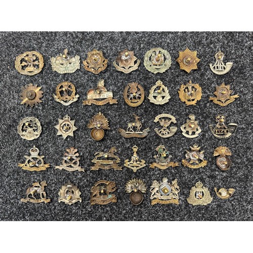 502 - A large collection of WW1/WW2 British military cap badges, however all have had the sliders and lugs... 