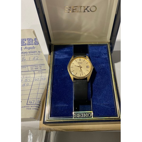 509 - A Seiko day/date wristwatch with box and papers