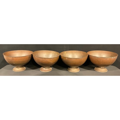 524 - Interior Decoration - a set of four large copper and brass pedestal bowls, 42cm diameter, 25cm high