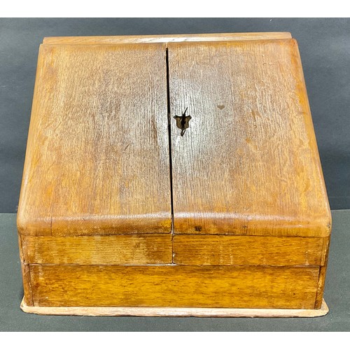 551 - A large Victorian oak slope front desk top stationery box, c.1890