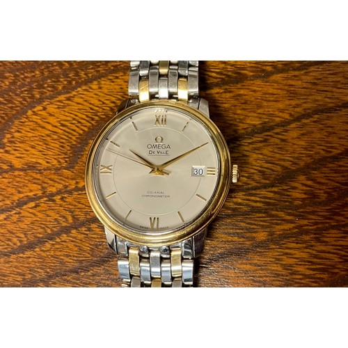 1009 - Omega - a stainless steel and gold Automatic Calendar Centre Seconds Wristwatch, 36mm diameter case,... 