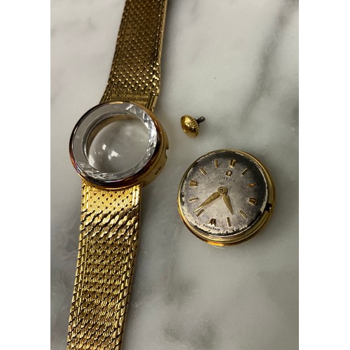 1014 - Omega - a late 1950s lady's 18ct gold cased bracelet wristwatch, faceted glass edged crystal, silver... 