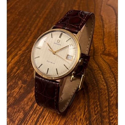 1033 - Omega - a 9ct gold cased Geneve 1061 wristwatch, stripped textured dial, block baton markers, date a... 