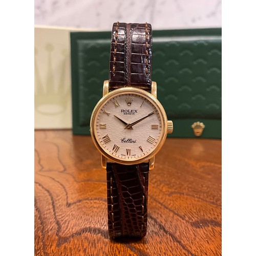 1050 - A lady's 18ct gold Rolex Cellini wristwatch, the Champagne dial with Roman numerals, winder with cro... 