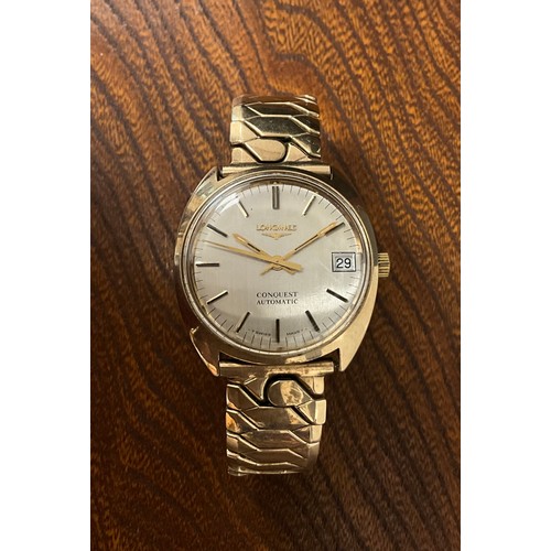 1057 - Longines  - a Conquest Automatic presentation wristwatch, gold coloured tonneau case, brushed silver... 