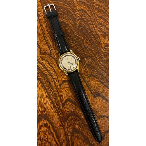 1097 - A 1940s Record rolled gold cased wristwatch, stepped lug case, two town copper and cream dial, Roman... 