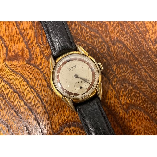 1097 - A 1940s Record rolled gold cased wristwatch, stepped lug case, two town copper and cream dial, Roman... 