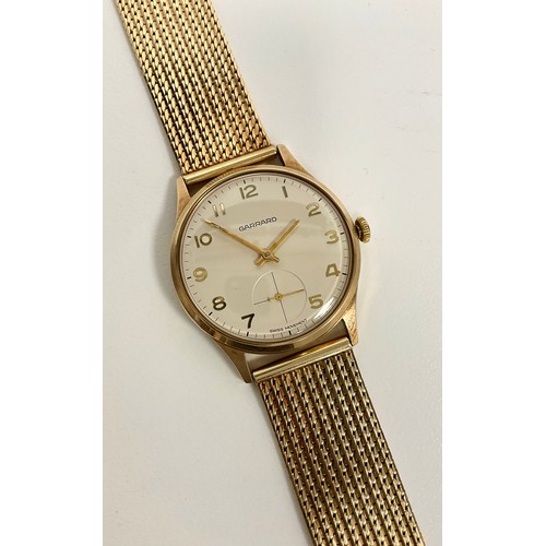 1011 - A Garrard 9ct gold cased wristwatch, cream dial, raised Arabic numerals, subsidiary seconds, manual ... 