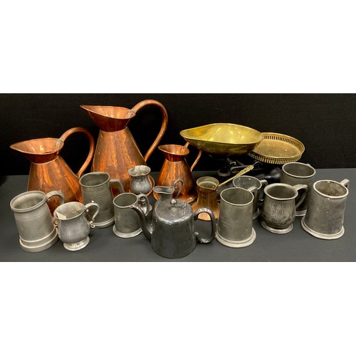 88 - A set of three graduated copper haystack jugs, kitchen scales, pewter mugs, etc