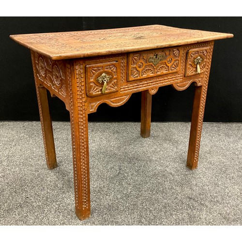 96 - A carved oak low boy / hall table, 70.5cm high x 85cm wide x 52.5cm deep, 20th century.