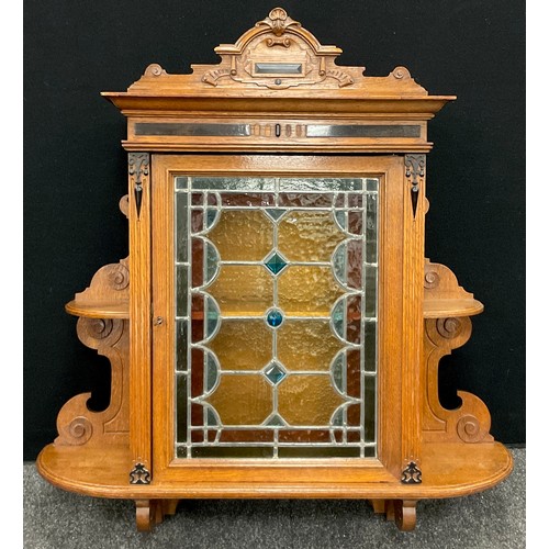 152 - A Dutch Wall-mounted medicine cabinet, shaped pediment, stained glass and leaded door, two tiers of ... 