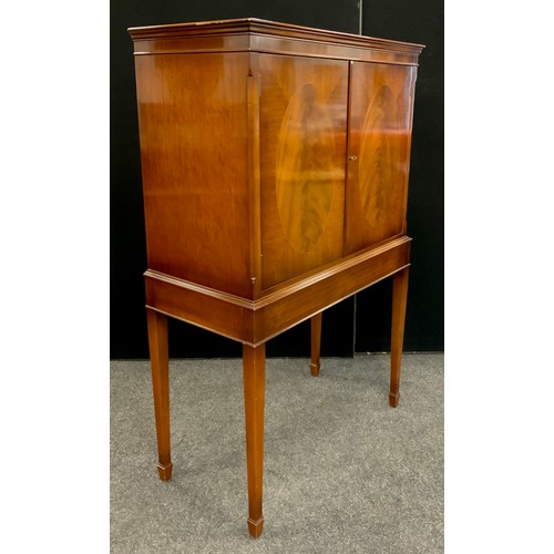 155 - A mahogany cocktail cabinet by Glenister, of High Wycombe, in George III style, with moulded cornice... 