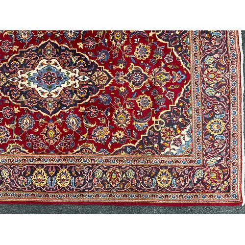 102 - A Central Persian Kashan Rug / carpet, hand-knotted, navette-shaped medallion, within a stylised scr... 