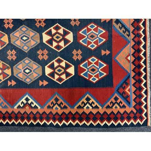 105 - A South West Persian Qashgai Kilim rug / carpet, 290cm x 173cm.