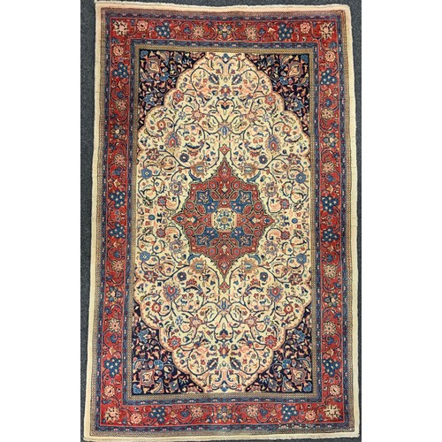 106 - A North West Persian Sarouk rug, hand-knotted wool and silk mix carpet, ornate medallion within a fi... 