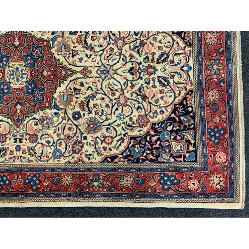 106 - A North West Persian Sarouk rug, hand-knotted wool and silk mix carpet, ornate medallion within a fi... 