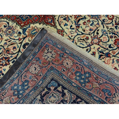 106 - A North West Persian Sarouk rug, hand-knotted wool and silk mix carpet, ornate medallion within a fi... 