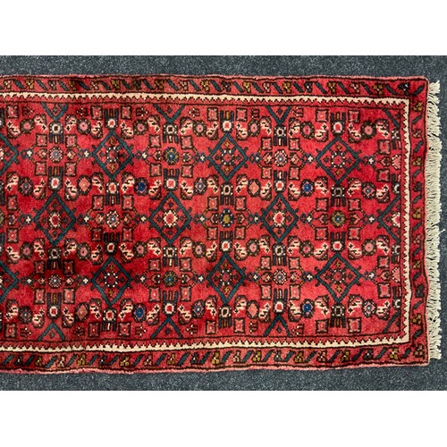 177 - A North West Persian Malayer runner, hand-knotted in rich red, with blue, and white, 370cm x 63cm.