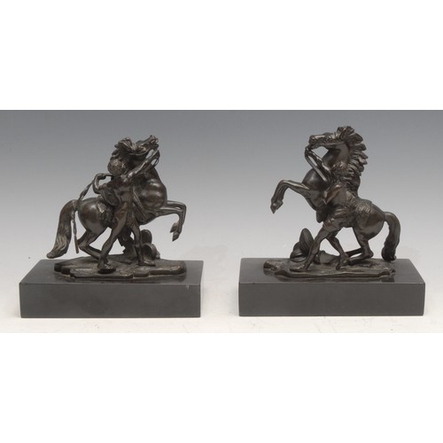 39 - After Guillaume Coustou (19th century), a pair of dark patinated bronzes, The Marli Horse Tamers, re... 