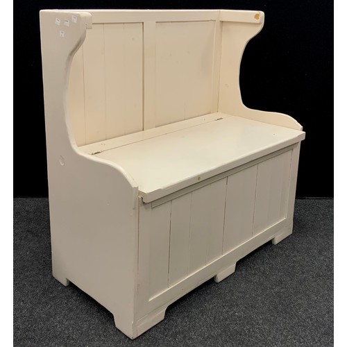 178 - A pine hall settle, painted white, hinged lift-up seat enclosing storage, 92cm high x 89cm wide x 45... 