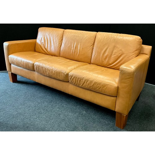 213 - A Natuzzi Italia pale tan leather three seat sofa, 98cm high (57cm high to seat) x 225cm wide x 94cm... 