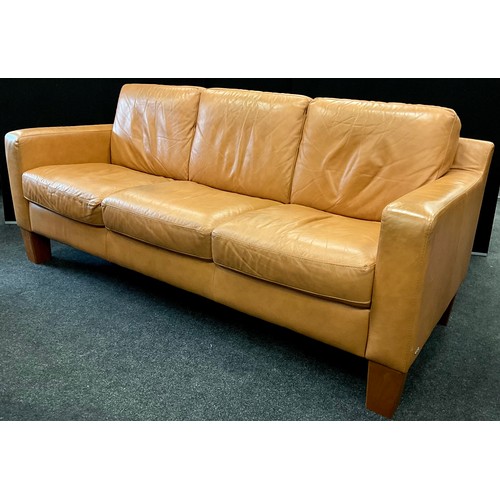 215 - A Natuzzi Italia pale tan leather three seat sofa, 98cm high (57cm high to seat) x 225cm wide x 94cm... 