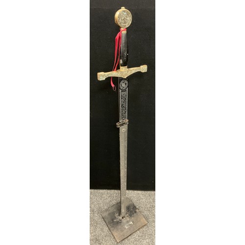 180 - A replica long sword ‘Excalibur’, on stand, 119cm long.