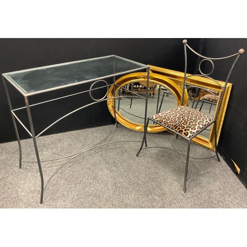 184 - A contemporary wrought iron effect glass-top dressing or console table and chair, the table measurin... 