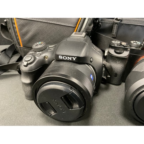 241 - Cameras - Two Sony digital cameras inc alpha 7, 28-70mm lens, serial number 4052255;  Exmor R Cybers... 