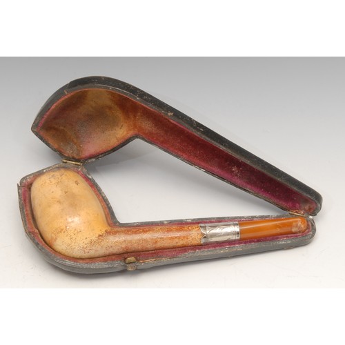 236 - A German silver coloured metal mounted meerschaum pipe, 16cm long, c.1900, cased; a cheroot holder, ... 