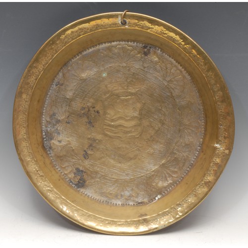 238 - A Dutch brass dairy bowl, chased to verso with the arms of Zeeland and bearing date of 1731, 38cm di... 